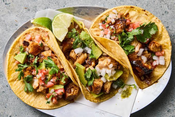 Chicken tacos with avocado and lime